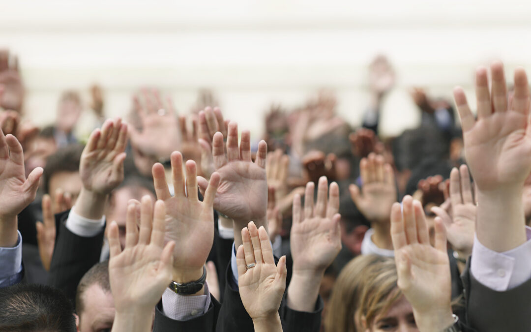 financial stress business crowd raising hands