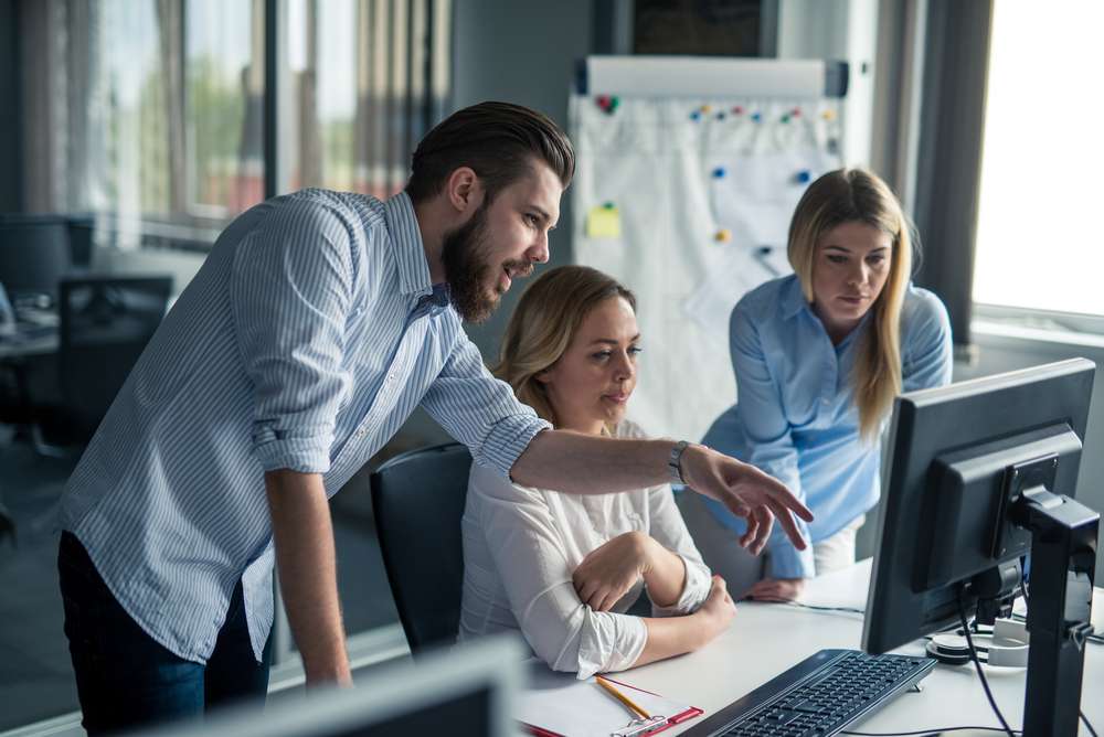 An image of employees discussing gamification.